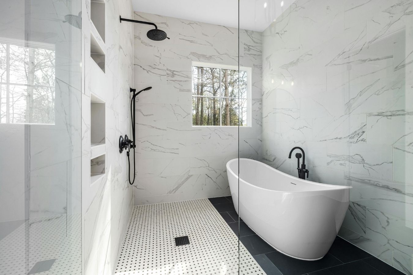 Frameless shower screen and floor tiling in a modern bathroom