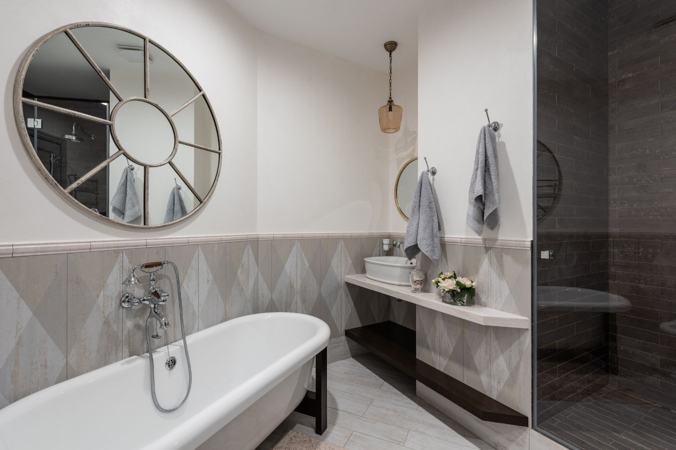 Wall niche and tapware detail in a fully tiled bathroom