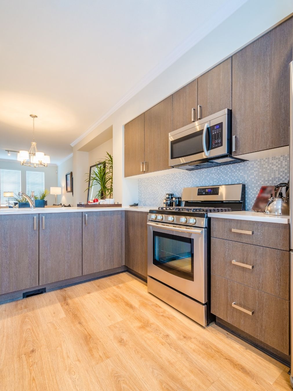 Warm LED-lit kitchen island with timber and stone finishes