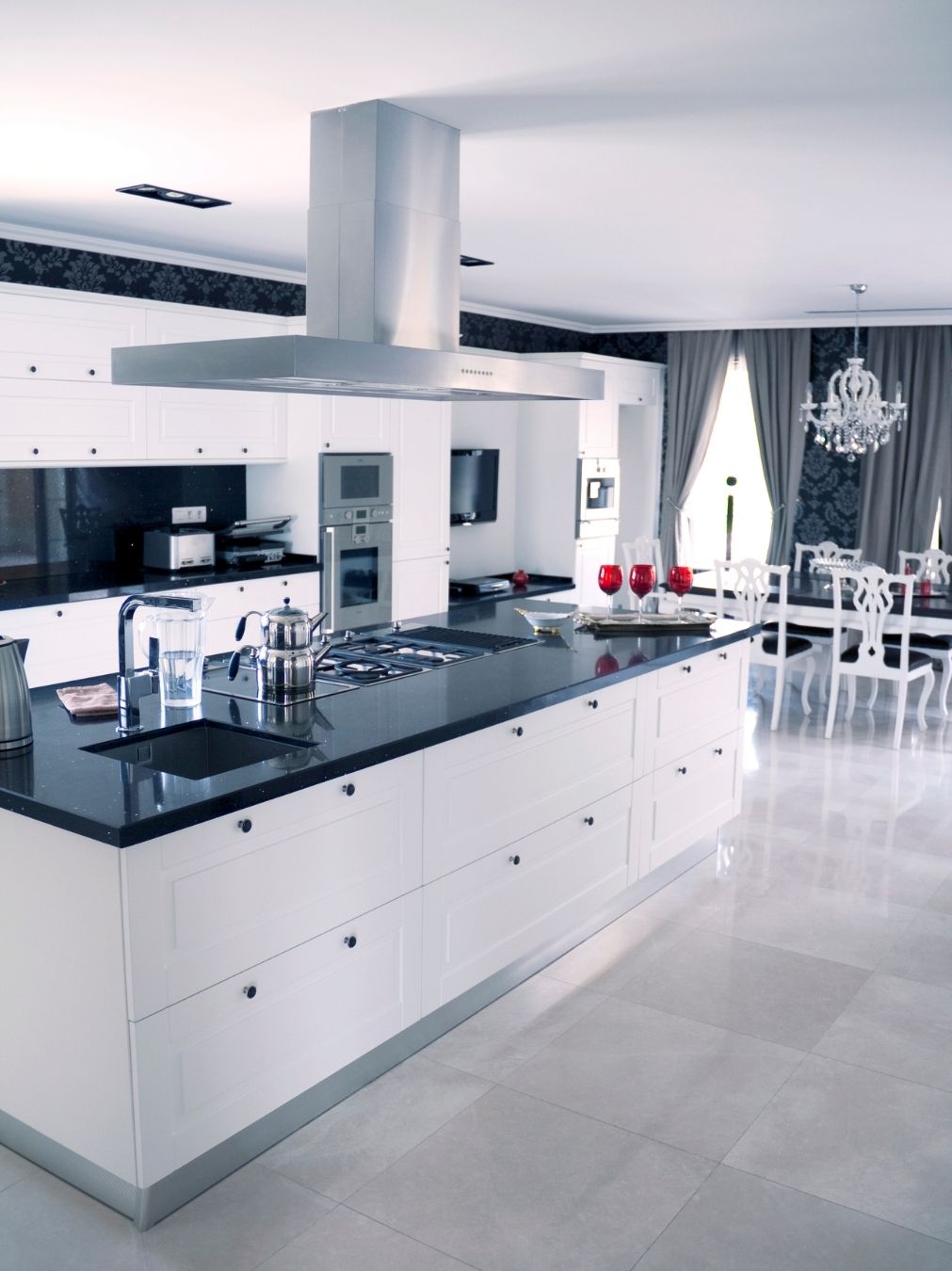 Marble feature wall and range hood in a renovated kitchen