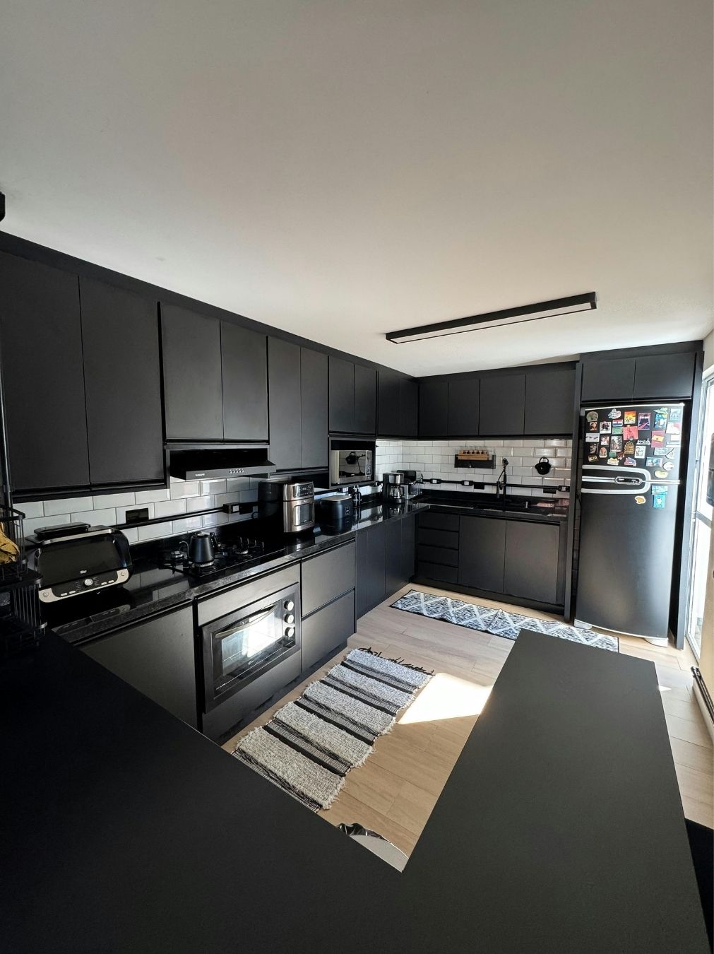 Waterfall-edge marble island in a contemporary kitchen