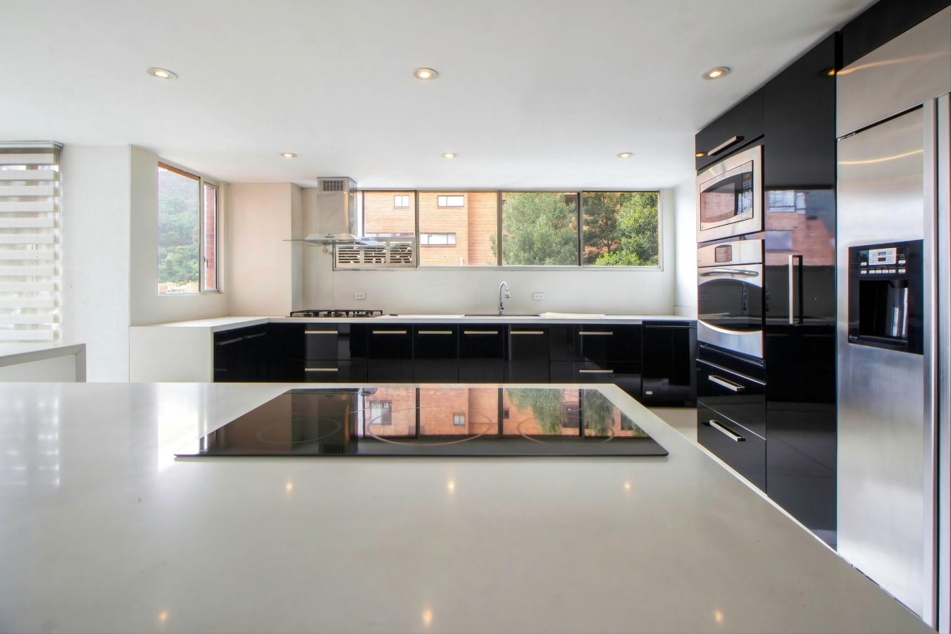 Open plan kitchen with feature pendant lighting