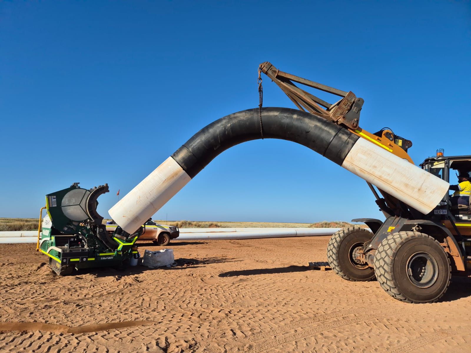 Kogalo TMS operator welding HDPE pipe on a civil site